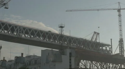 The crane moves construction bar in the evenings. construction Stock Footage 64889202