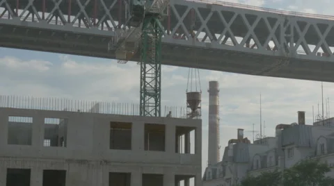 The crane moves construction bar in the evenings. construction Stock-Footage 64889489