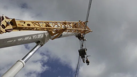 Crane moving across electric wire Stock Footage 91644607