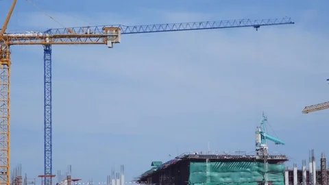 Crane moving construction panel with blue sky Video stock 81079533