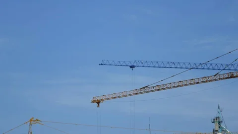 Crane moving construction panel with blue sky Stock-Footage 81080704