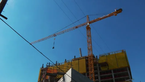 Crane Moving at a Construction Site Stock Footage 240512018