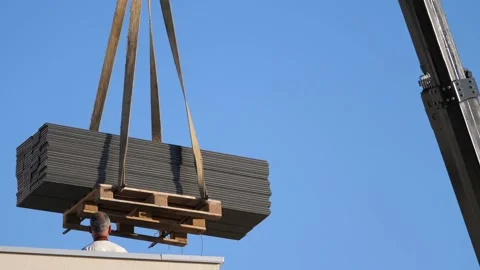 Crane moving, construction site with two workers Stock Footage 143002130