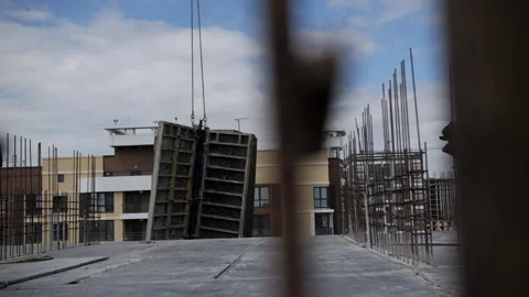 Crane moving formwork panels at construction site Stock Footage 314234730