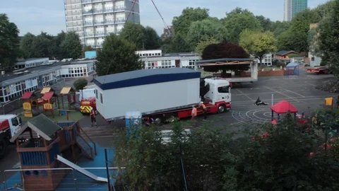 Crane moving a house module in position Video stock 86010722