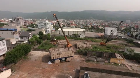 Crane is moving huge concrete blocks on a construction site. Time lapse Stock-Footage 167068686