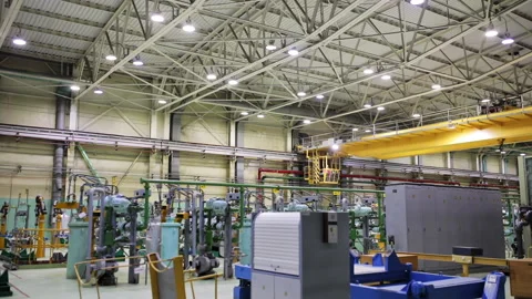 A Crane is Moving inside of the Production Room for the Radioactive Material Stock Footage 269012503