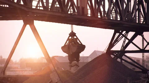 Crane moving sand. slow motion. silhouette. industrial trade business Stock Footage 33793242