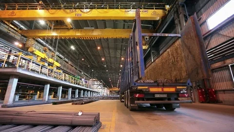 Crane moving steel bars in the warehouse, wide shot Stock Footage 72424112