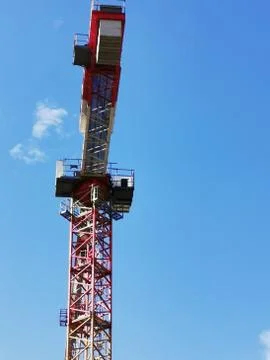 A crane next to a tower Stock Photos