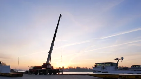 Crane offloading pulp from ship long shot Stock Footage 294352918