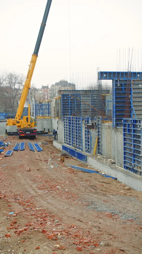 Crane Operating at Concrete Formwork Construction Site Stock Footage 296755784