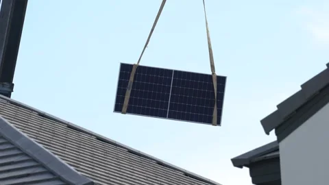 Crane operation is lifting a solar cell panel for installation. Stock Footage 253484216
