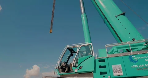 Crane operator controls the crane. Rotating the mobile crane cab. Video stock 136842614