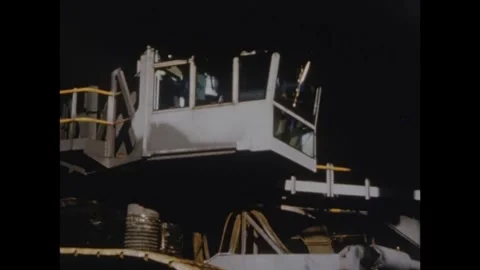 Crane operator driving the crane during the roll out of the Apollo 8 spacecraft Stock Footage 297183607
