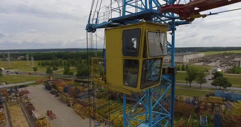 Crane operator enters the crane cabin to lift construction objects Stock Footage 265846824