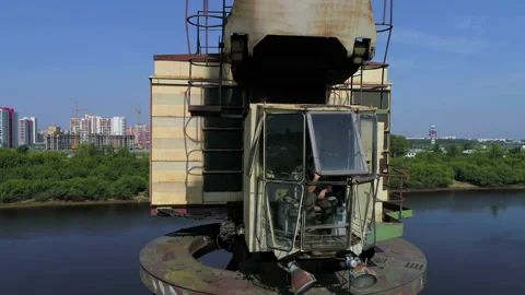 Crane operator sits in the crane cab Stock Footage 93295455