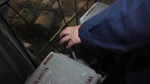 The crane operator’s hand moves the lever and controls the overhead crane. Stock Footage 125547975