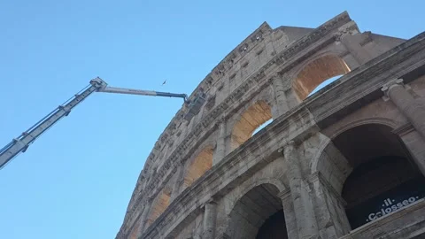 Crane performing maintenance, construction of the exterior Colosseum Stock Footage 346641382
