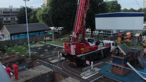 Crane picking up a house module Video stock 86013340