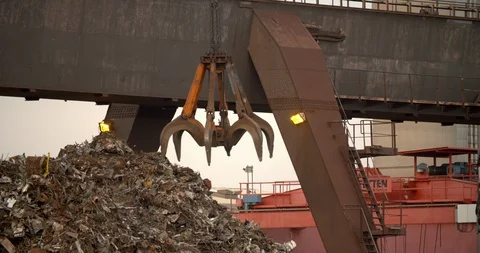 Crane picking up metal scrap into a ship, recycling company in Germany 4K Stock Footage 102866817