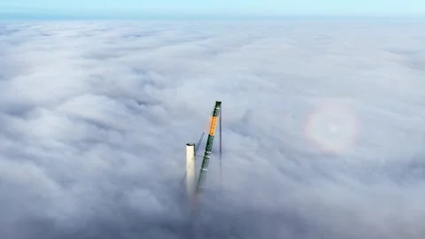 Crane pierces through thick cloud with brocken spectre phenomenon Stock Footage 330868499