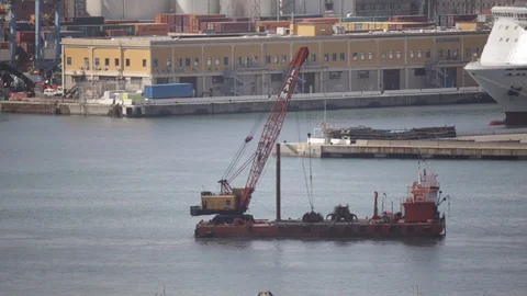Crane on pontoon which dredges the seabed of the port 06 Stock Footage 126287994