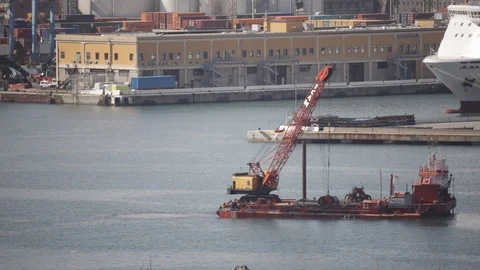 Crane on pontoon which dredges the seabed of the port 04 Stock Footage 126288100