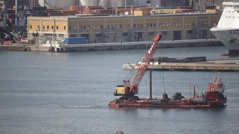 Crane on pontoon which dredges the seabed of the port 02 Stock Footage 126314170