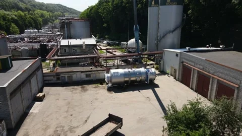 Crane preparing to move heavy steel equipment. Aerial view. 動画素材 159909328