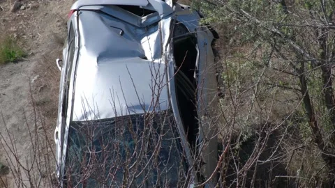 A crane pulled the wrecked car out of a deep hole. Evacuator. The victim of the Vidéo 145576618