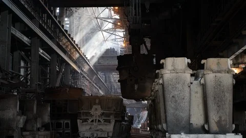 A crane pulls a huge bucket in the casting shop Stock Footage 116774675