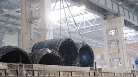 Crane raises large black spools on special metal chains Stock Footage 124003132