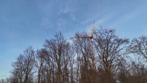 Crane rise over trees into vast wind farm panorama Stock Footage 341470395