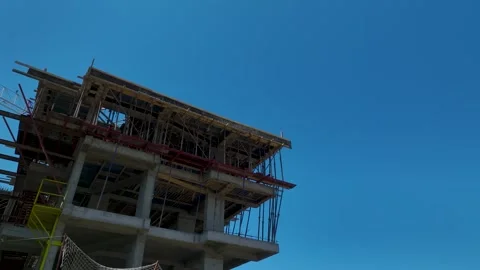 A crane rising high with mountains in the background. Stock Footage 342835770