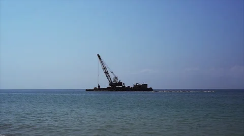 Crane on sea platform works. Stock Footage 67986853