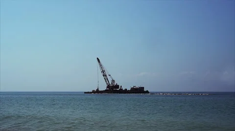 Crane on sea platform works. Видео 67987326
