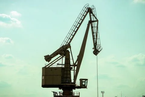 Crane in the seaport for coal loading. Stock Photos