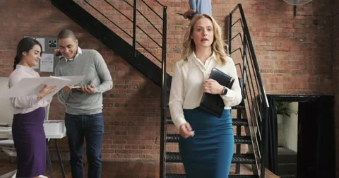 Crane shot in busy office open plan boardroom area Stock Footage