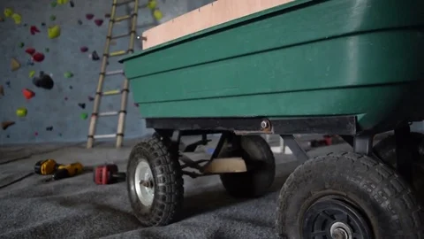 Crane Shot Climber Route Setting with Ladders and Climbing Hold Trolley Stock Footage 70872605