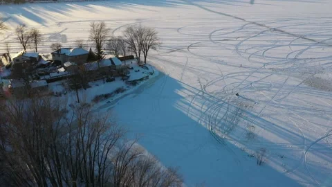 Crane shot with a drone coming down showing the houses by the river Stock-Footage 164252961