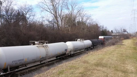 Crane Shot Of Fast Moving Freight Train with Tank and Hopper Cars, Drone, 4k Stock Footage 124901530