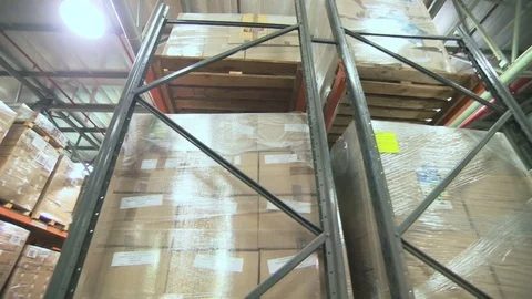 Crane shot of a forklift working in a large warehouse Stock Footage 71632382