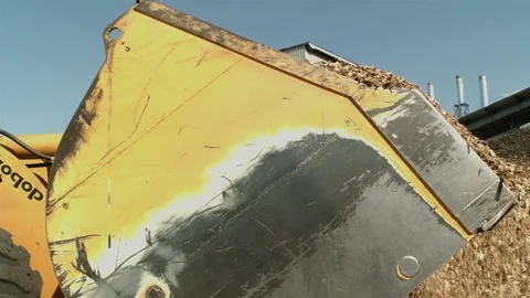 Crane shot of a loader removing sawdust Stock Footage 71165147