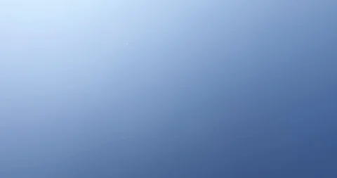 Crane shot of medieval stone tower from blue sky to stone under the tower Видео 118533423