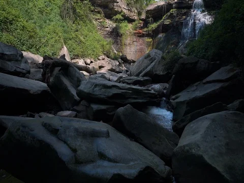 Crane shot over small waterfall in ohio stream Video stock 77156662
