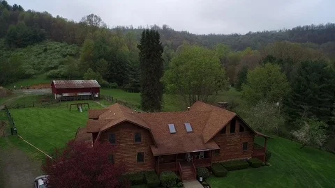 Crane Shot of Remote Log House and Farm Stock Footage 70602256