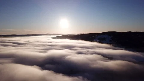 Crane shot of rising over the clouds towards sun in Drammen, Norway Stock Footage 85819709