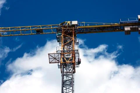 Crane, sky background with clouds Stock Photos