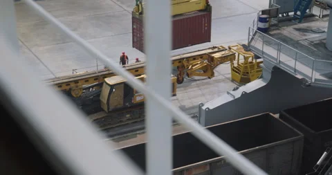 Crane slowly lowers container to dock under workers watch Stock-Footage 319831966